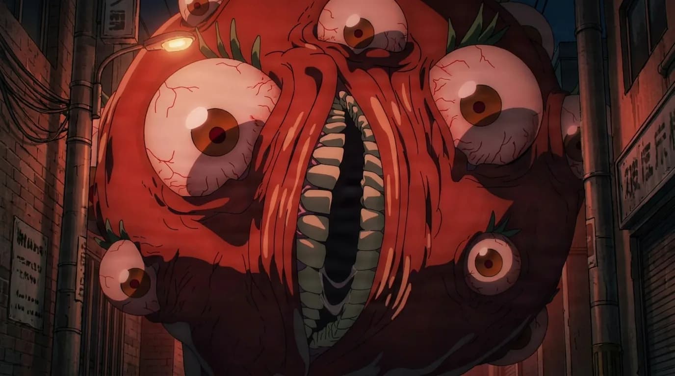 A monstrous red tomato-shaped devil covered in many bloodshot eyeballs bares a wide fanged mouth as it looms in a narrow city alley at night lit by a glowing streetlamp.