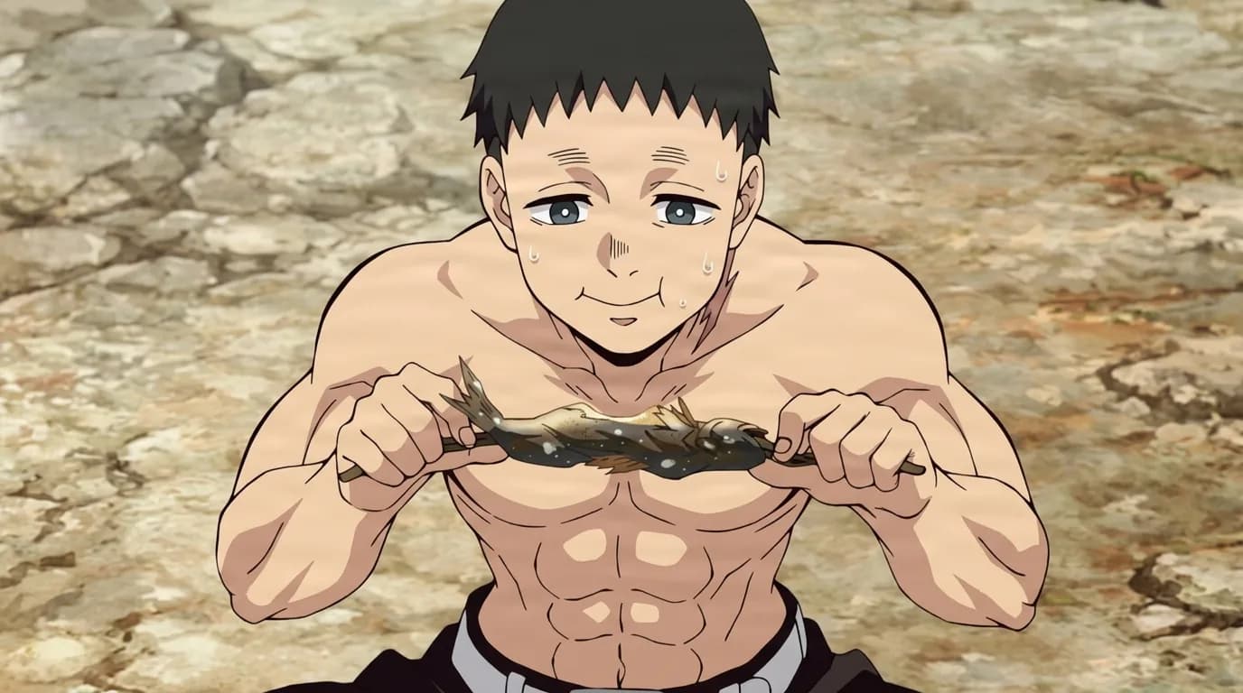 Rapaz musculoso sem camisa com cabelo preto curto segurando um peixe grelhado em um espeto sobre um terreno rochoso.