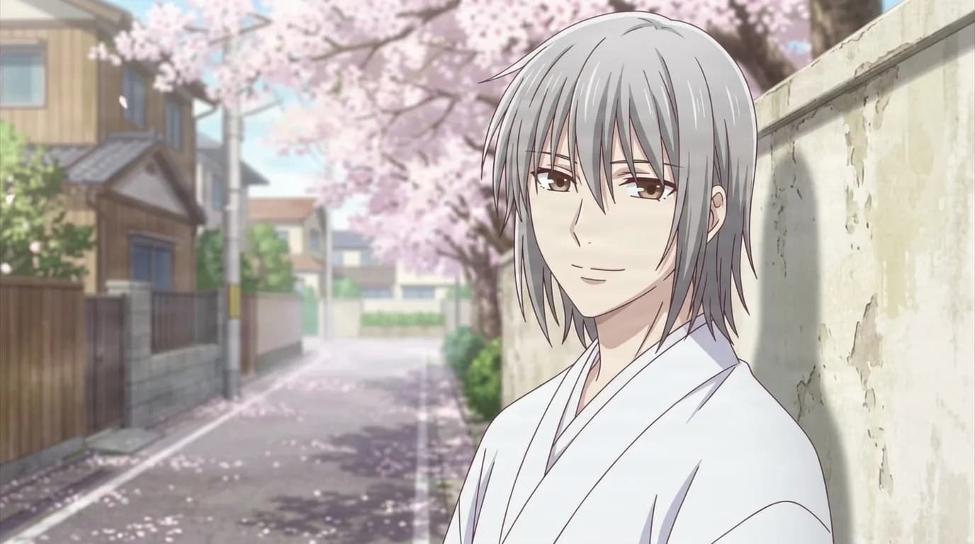 Akira Sohma with shoulder-length silver hair and amber eyes, wearing a white kimono and smiling faintly on a residential street under blooming cherry trees