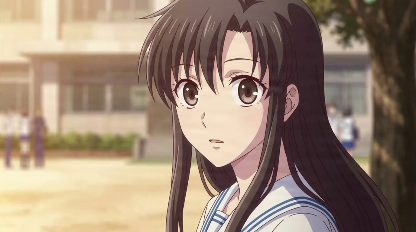 Kimi Toudou with long brown hair and hazel eyes in a white sailor uniform, turning toward the viewer in a sunlit schoolyard
