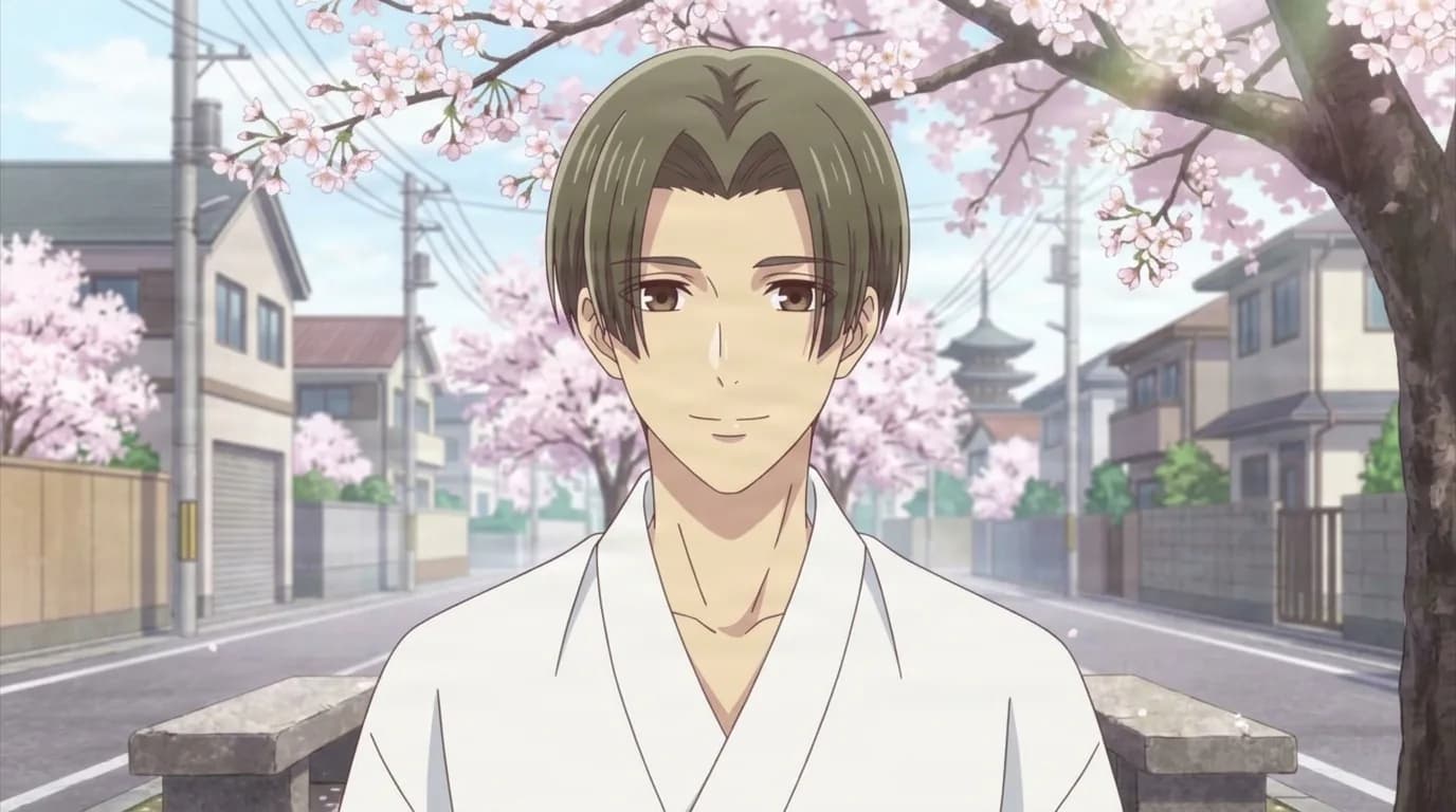 Kunimitsu Tomoda, an olive-haired man in a white kimono smiling faintly on a suburban street lined with cherry blossom trees