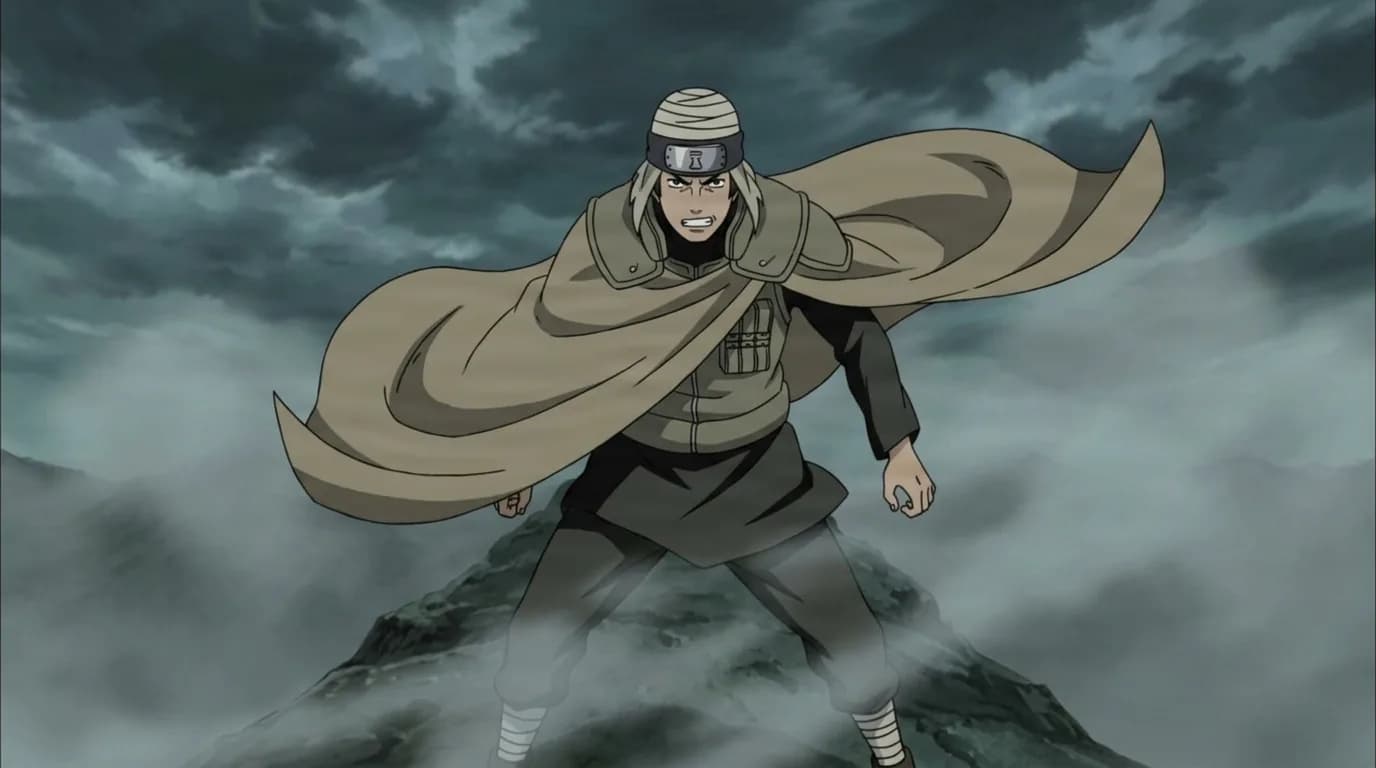A grey haired ninja in a billowing tan cloak stands braced on a misty mountain ridge under a heavy grey sky, teeth gritted in fierce determination