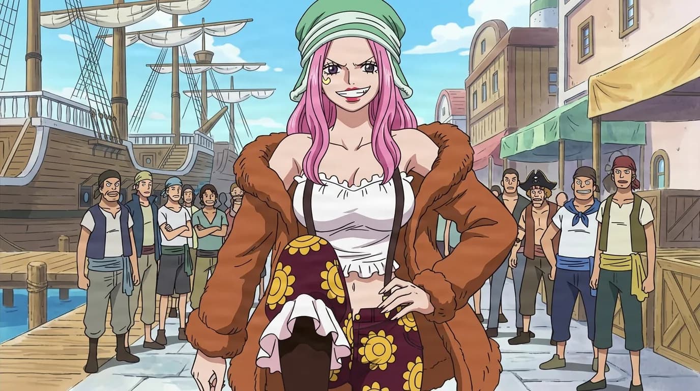 Pink-haired woman in a green cap and fur-lined jacket grinning with a hand on her hip on a crowded port street lined with ships and onlookers.