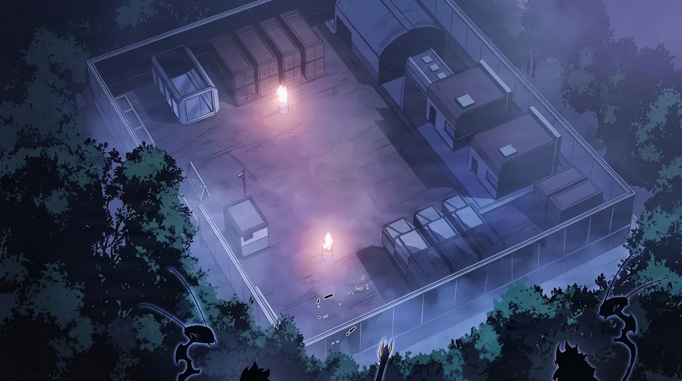 An overhead night view of a walled industrial compound filled with shipping containers and low buildings, two small candle flames glowing on the misty pavement, dark trees framing the edges.